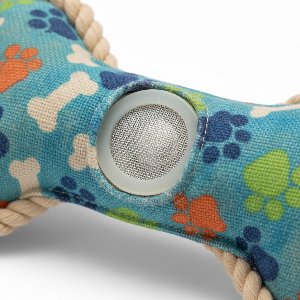 Dog toy with colorful paw and bone patterns on a blue background