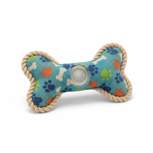 Dog toy with bone shape and colorful paw prints on a blue background